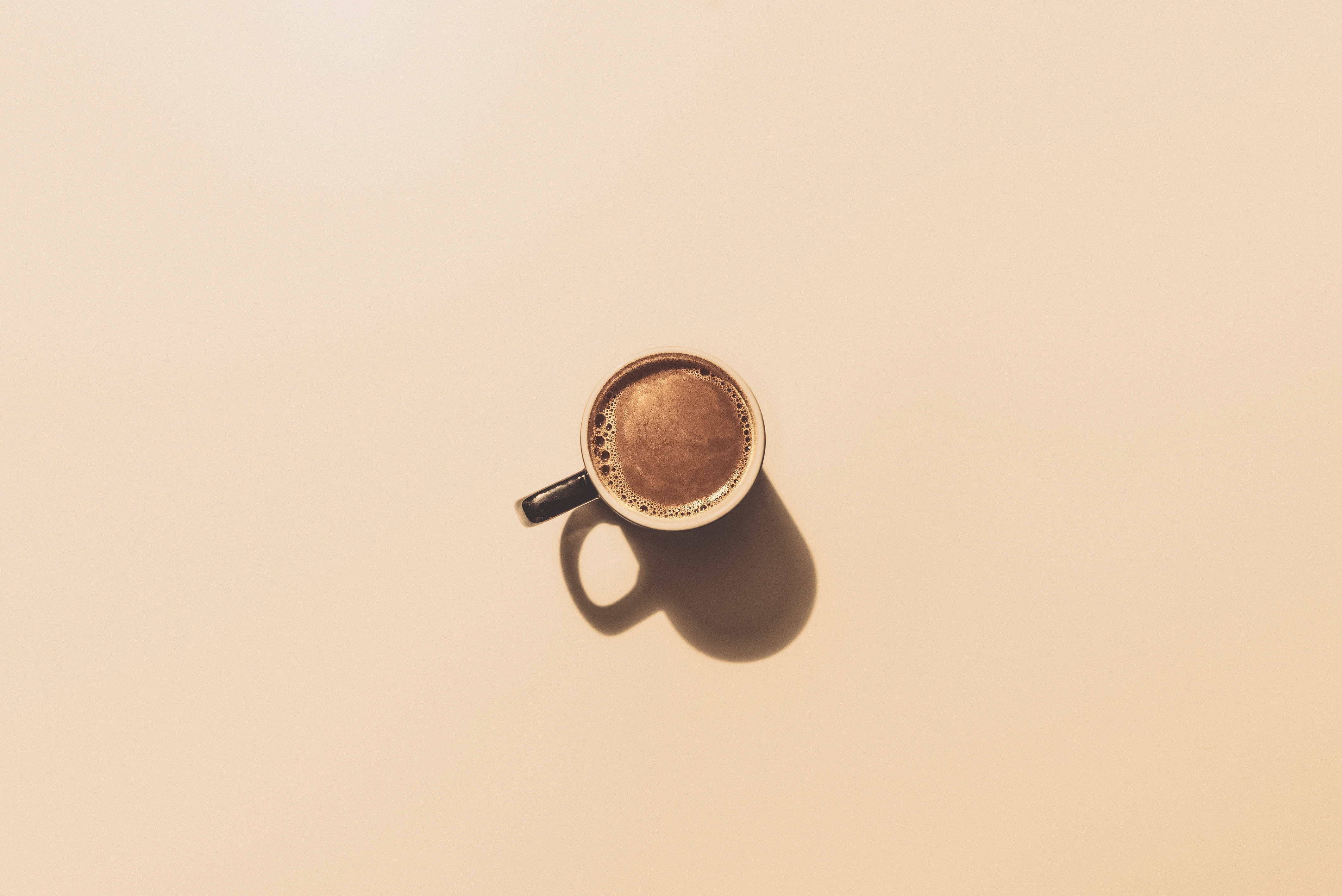 plain background, top down picture of a coffee