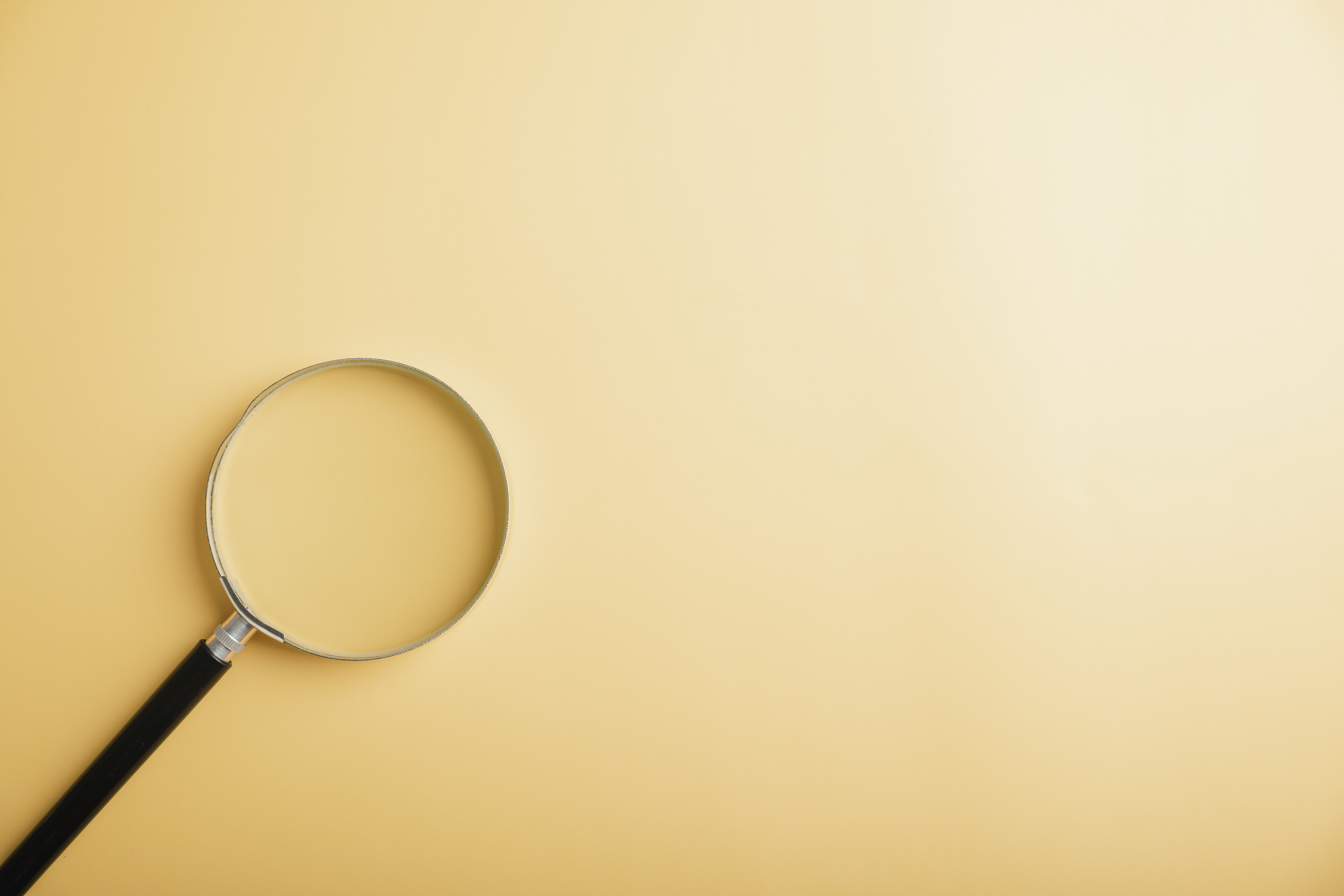magnifying glass on yellow background
