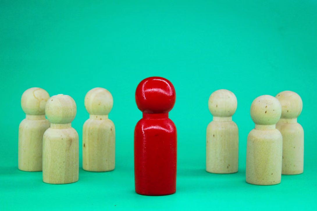 red figure standing out against the green backgroun